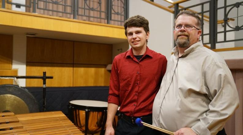 David Walker, left, is director of percussion studies at Old Dominion University. Here, he poses on stage at Chandler Recital Hall with his son Michael, a percussionist and student at ODU.