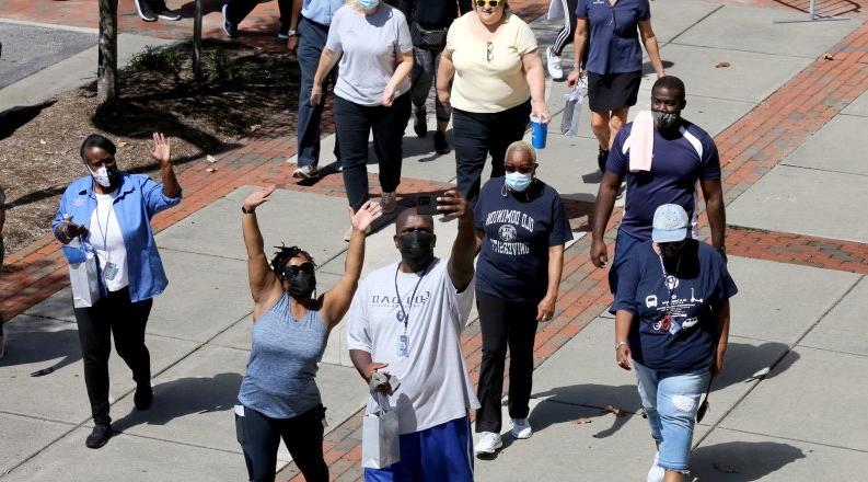 ODU employees start their Monarch Wellness Walk in front of Webb University Center.