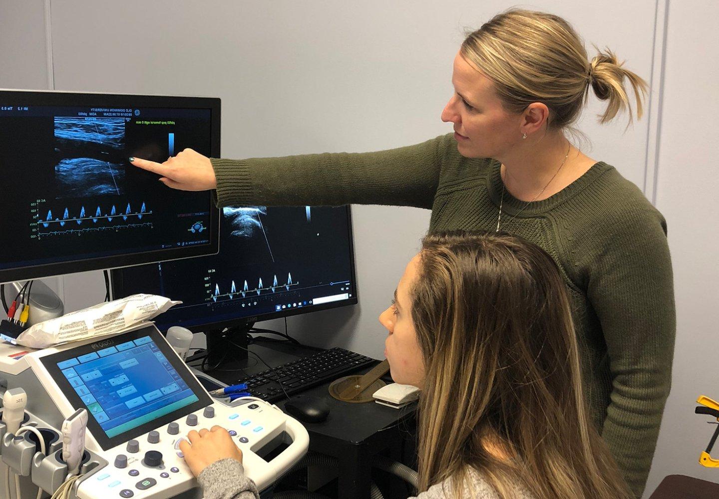 Leryn Reynolds describes Doppler Ultrasound to a trainee