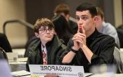 Two students sitting at a table.