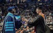 President Brian O. Hemphill, Ph.D., congratulates a student at Old Dominion University's commencement exercises on May 6 at Chartway Arena. Photo Chuck Thomas/ODU