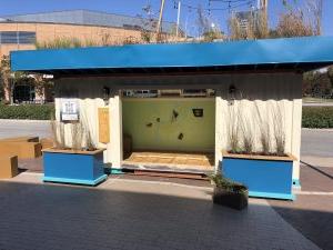 Photo of a shipping container decorated with plants.