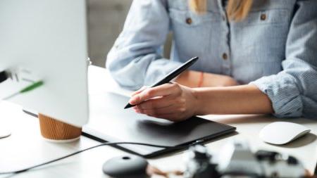 Cropped image of young woman work in office