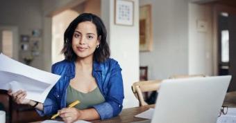 Woman at laptop smiling